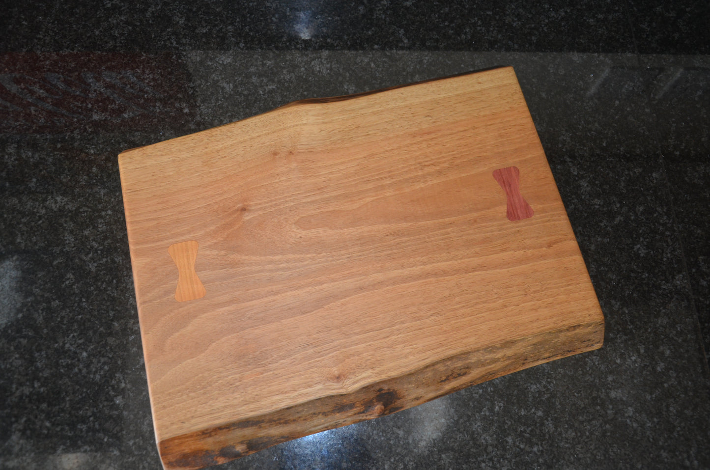 Walnut Chopping Board with Purple Heart and Cherry Bow Tie Inlays.