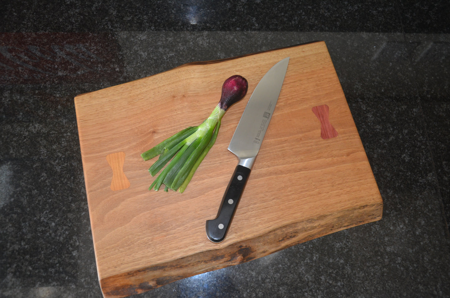 Walnut Chopping Board with Purple Heart and Cherry Bow Tie Inlays.