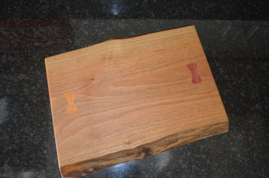 Walnut Chopping Board with Purple Heart and Cherry Bow Tie Inlays.