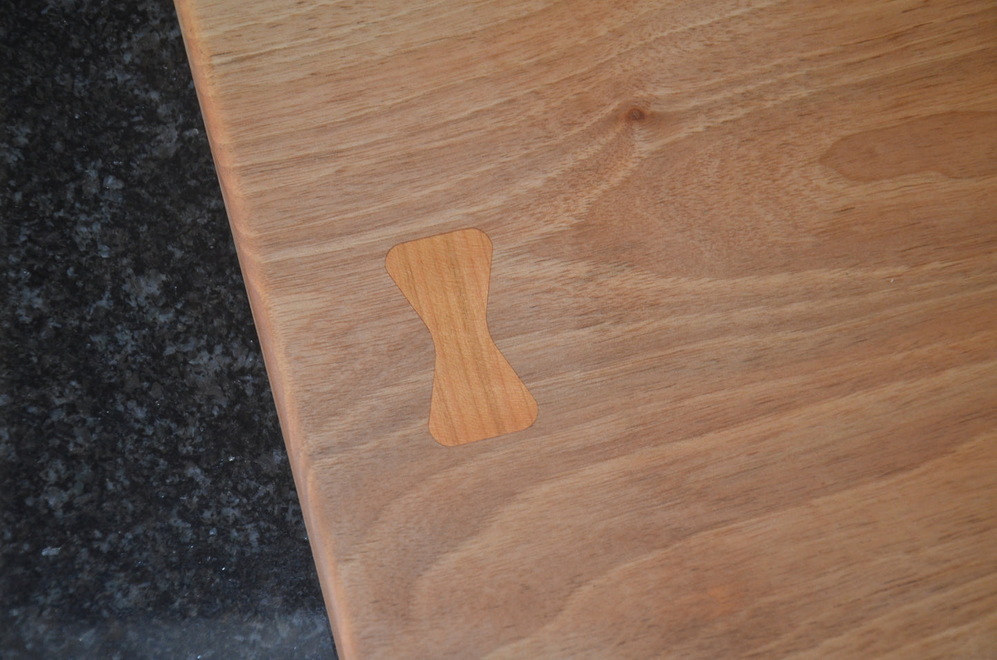 Walnut Chopping Board with Purple Heart and Cherry Bow Tie Inlays.
